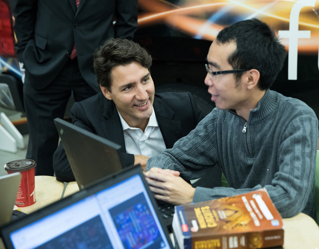 Prime Minister Trudeau talks with a college student