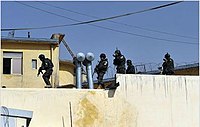 Afghan police on roofs during kabul feb 09.JPG