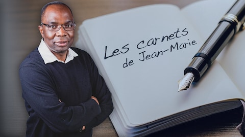 Jean-Marie Yambayamba avec un carnet