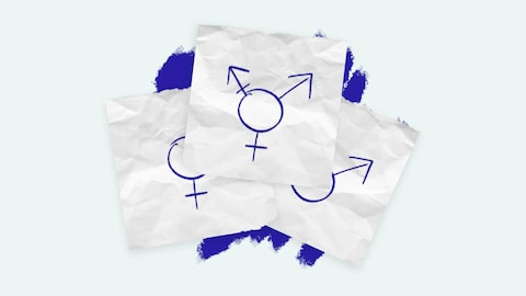 Sur trois feuilles de papiers, on voit un symbole transgenre qui cache les symboles masculin et féminin.