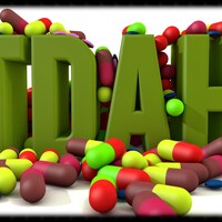 TDAH écrit en logo avec des pilules.