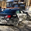 Une voiture de police après son accident avec le véhicule d'un civil.