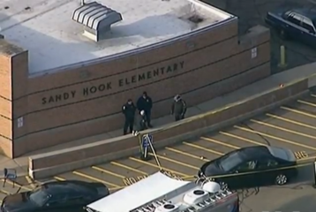 Police are seen at Sandy Hook Elementary School after a school shooting.