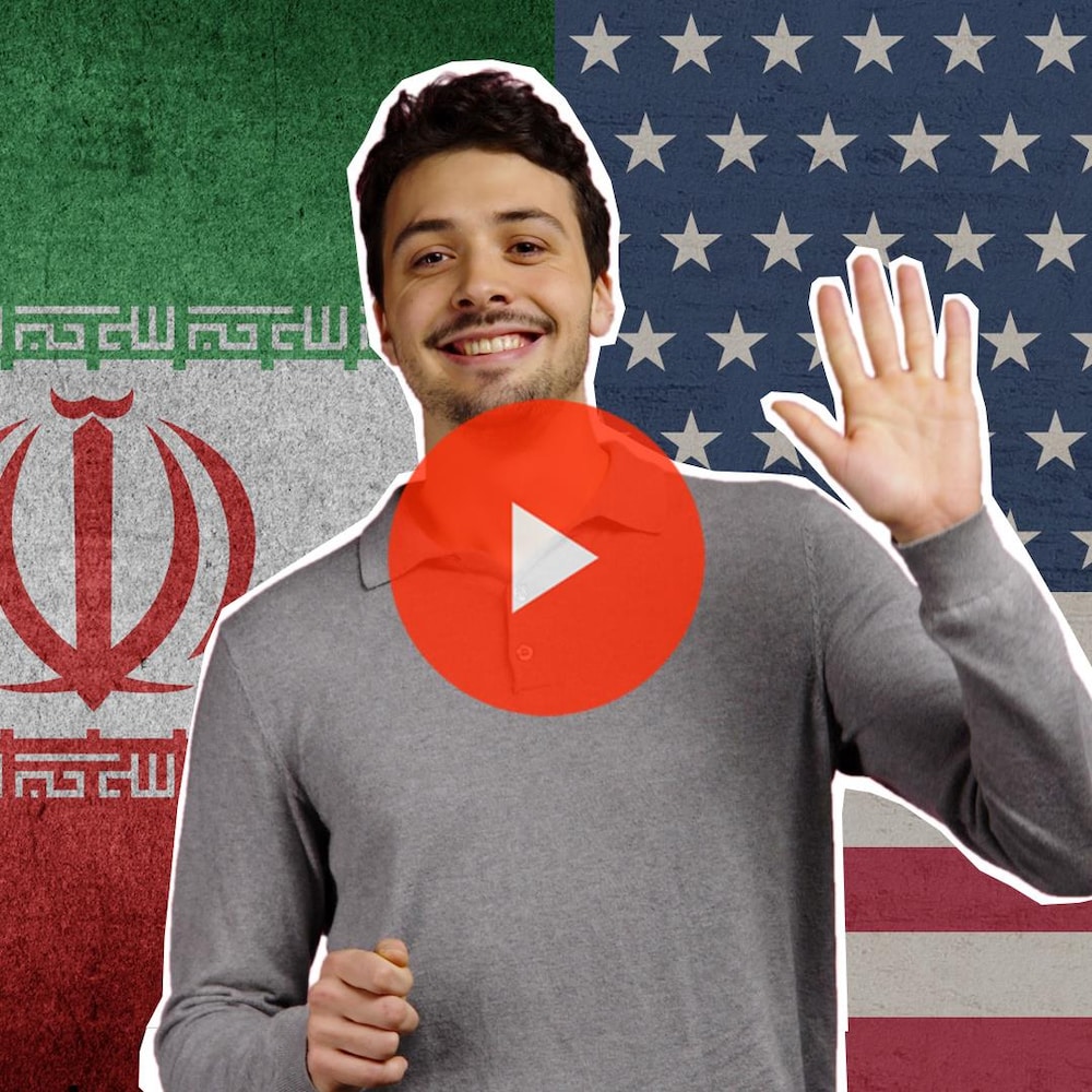 Thomas, devant les drapeaux iranien et américain, salue d'un air candide.
