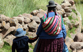 Mother and child walking in Peru