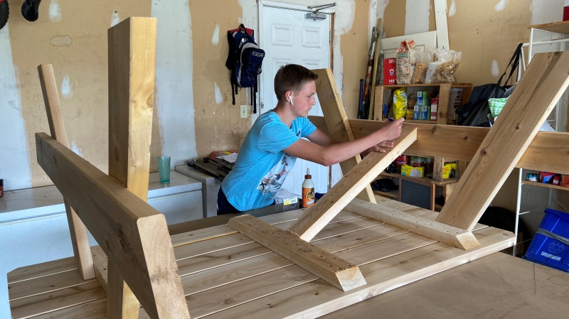 Isaac Young, 15, of Arnprior, Ont. started his own woodworking business after he couldn't find a summer job due to COVID-19. (Dylan Dyson / CTV News Ottawa)