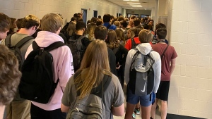In this photo posted on Twitter, students crowd a hallway, Tuesday, Aug. 4, 2020, at North Paulding High School in Dallas, Ga. (Twitter via AP, File)