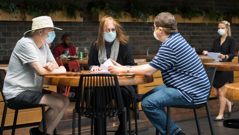 Patrons sit on the patio at Joey Sherway, part of the Joey Restaurant chain during the COVID-19 pandemic in Toronto on Wednesday, June 24, 2020. THE CANADIAN PRESS/Nathan Denette