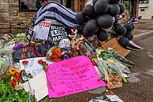 Tribute items left at site of death forming a makeshift memorial