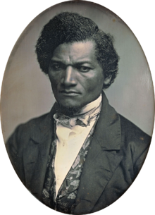 Black and white portrait photo of Frederick Douglass