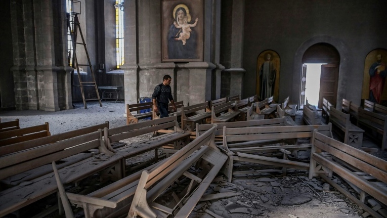 The floor is strewn with rubble after an attack on Ghazanchetsots (Holy Saviour) Cathedral in the historic city of Shusha, on the outskirts of the disputed Nagorno-Karabakh province's capital Stepanakert. (AFP)