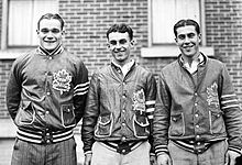 Three players from the Toronto Maple Leafs' "Kid Line" standing next to each other outside in team apparel.