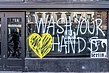 Wash your hands window in Dame Street Boarded up