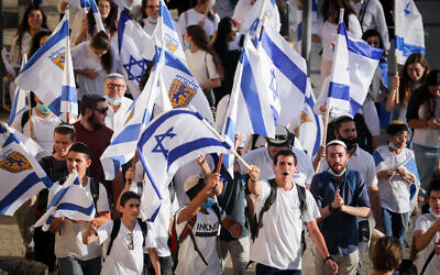 Young Jewish men celebrate Jerusalem day around the Old City walls of Jerusalem, May 21, 2020 (Yonatan Sindel/Flash90)