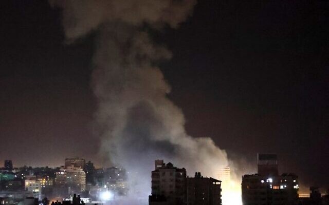 Smoke billows from Israeli air strikes in Gaza City on May 12, 2021. (Photo by MOHAMMED ABED / AFP)