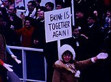 Cole with a recreation of her sign at the 1969 inaugural parade