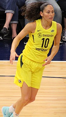 Point guard Sue Bird in yellow Seattle Storm uniform, number 10