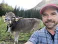 Christof Marti gets up close with a cow on Mount Pilatus.