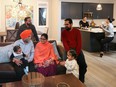 Daljit and Joginder Kang with their grandchildren Amreen Kang, 1, and Japnaaz Dhillon, 1, surrounded by their son Sukhpal Kang and son-in-law Amandeep Dhillon, while sisters Kajal Kang and Sukhbir Dhillon spend time in the kitchen. They love the spaciousness that their new home by Crystal Creek in Belvedere will afford them.