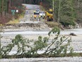 A road falls into the Coquihalla River near Hope, B.C., Thursday, December 2, 2021.  THE CANADIAN PRESS/Jonathan Hayward ORG XMIT: JOHV106_2021120223