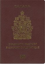 Cover of Canadian Diplomatic e-Passport. Cover is maroon colour with a gold-coloured crest. Text reads "CANADA" and "DIPLOMATIC PASSPORT" and "PASSEPORT DIPLOMATIQUE"