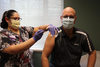 Mark Kreusel, plant manager at Stellantis NV's Belvidere Assembly Plant in Illinois, receives the COVID-19 vaccine at the company's health and wellness center.
