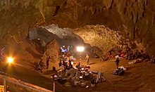 Supplies and people inside a cave
