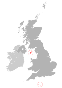 Location of the Crown Dependencies (red) relative to the United Kingdom (dark grey) and Ireland (light grey)