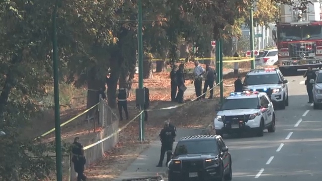 Police are seen outside Burnaby's Broadview Park on Tuesday, Oct. 18, 2022, after Const. Shaelyn Yang was fatally stabbed. 
