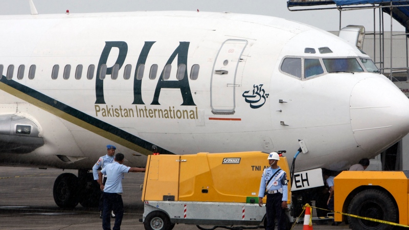 FILE - A Pakistan International Airlines passenger jet is parked on the tarmac (AP Photo)