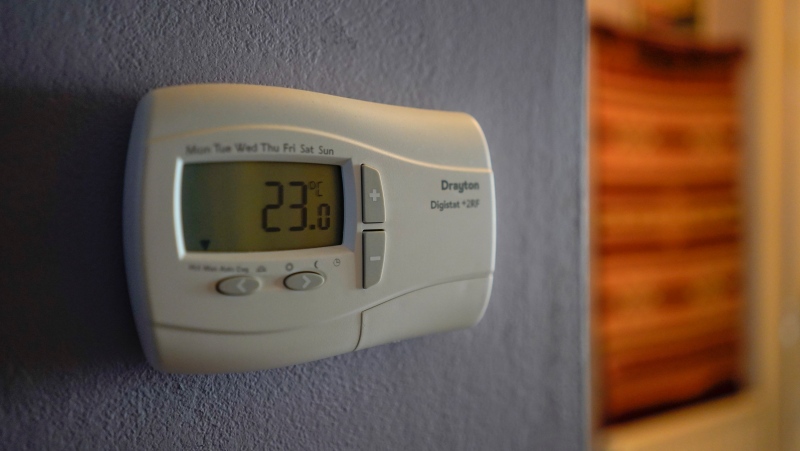 A thermostat is set to 23 degrees celcius. By heating homes more efficiently, experts say Canadians can save on their energy bills. (AP Photo/Alberto Pezzali)