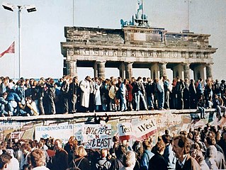 The Berlin Wall in front of the Brandenburg Gate, shortly before its fall in 1989