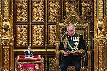 Charles seated on the Sovereign's Throne in the House of Lords during the 2022 State Opening of Parliament