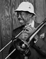 Image 1 Al Grey Photograph credit: William P. Gottlieb; restored by Adam Cuerden Al Grey (June 6, 1925 – March 24, 2000) was an American jazz trombonist who was known for his plunger-mute technique. After serving in World War II, he joined Benny Carter's band, then the bands of Jimmie Lunceford, Lucky Millinder, and Lionel Hampton. In the 1950s, he was a member of the big bands of Dizzy Gillespie and Count Basie before forming his own bands in the 1960s. This photograph by William P. Gottlieb shows Grey still performing into the 1980s. More selected portraits