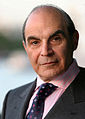 Image 3 David Suchet Photo credit: Phil Chambers A portrait of David Suchet OBE, an English actor best known for his television portrayal of Agatha Christie's Hercule Poirot in the television series Agatha Christie's Poirot. For this role, he earned a 1991 British Academy Television Award (BAFTA) nomination. In preparation for the role he says that he read every novel and short story, and compiled an extensive file on Poirot. More selected portraits
