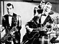 Image 21Bill Haley and his Comets performing in the 1954 Universal International film Round Up of Rhythm (from Rock and roll)