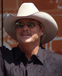 A head shot of country singer Alan Jackson, wearing a cowboy hat and sunglasses.