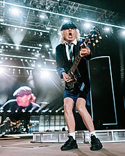 Angus Young performing in Indio, California in 2023 for the Power Trip music festival.