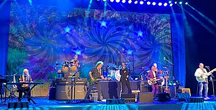 Ringo Starr & His All-Starr Band performing in 2022. (left to right) Edgar Winter, Warren Ham, Steve Lukather, Ringo Starr, Hamish Stuart, Gregg Bissonette and Colin Hay.