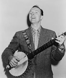 Seeger playing the banjo in 1955