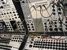 Earliest analog sequencers on Buchla 100 (array of knobs on the bottom)