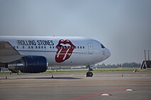 The band's plane in Amsterdam in October 2017; it has the band's tongue logo painted on the side.