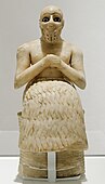 The Statue of Ebih-Il; circa 2400 BC; gypsum, schist, shells and lapis lazuli; height: 52.5cm