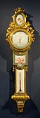 Louis XVI style barometer-thermometer; c. 1776; soft-paste Sèvres porcelain, enamel, and ormolu; height: 1 m, width: 0.27 m[97]